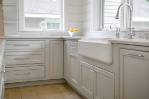 Lake House Kitchen Cabinetry farmhouse apron front sink dishwasher with panel cornercabinet