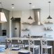 Geneva Cabinet Company Top 2018 Trends for Cabinetry modern farmhouse kitchen with open concept shelving and stainless range hood