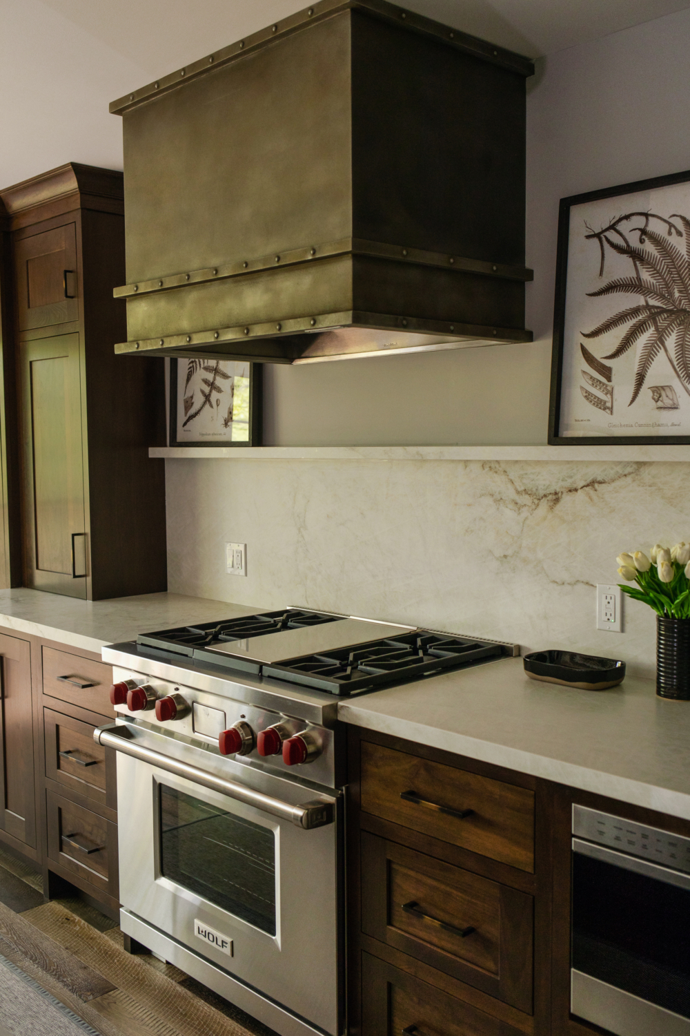 La Bastille Metal Hood, Shiloh Cabinetry, Photo by Shanna Wolf